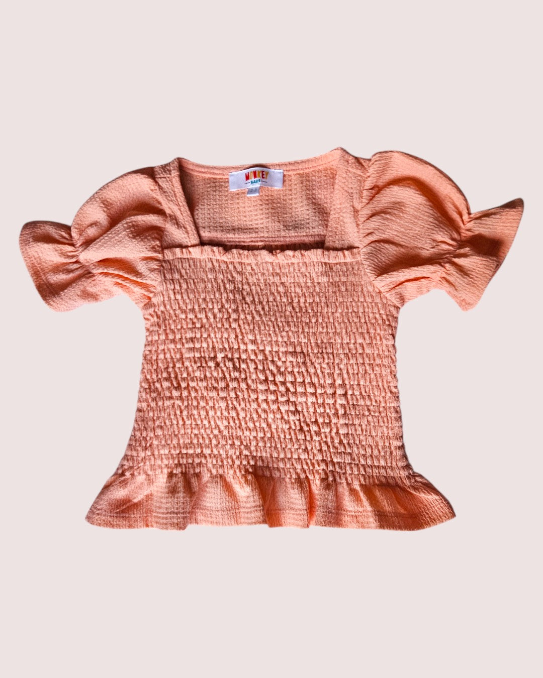 Monkey Bars smocked cap sleeve tee in a super cute peach colour 2-3T