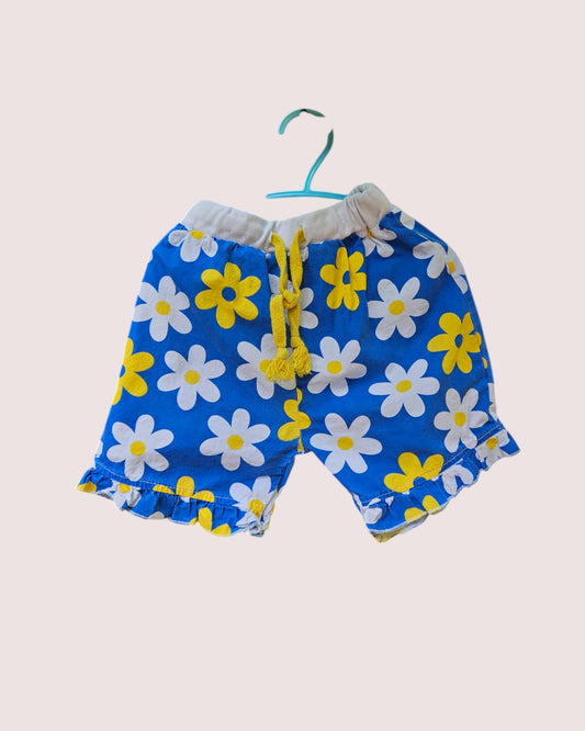 Mud kingdom daisy print shorts with ruffle hem 6-7Y